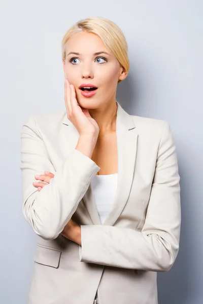 Businesswoman holding hand on cheek — Stock Photo, Image