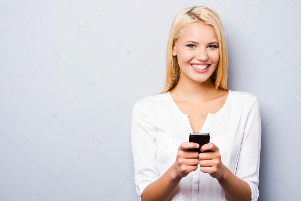 Woman holding smart phone