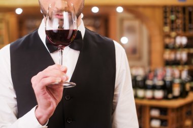 Man holding glass with wine clipart