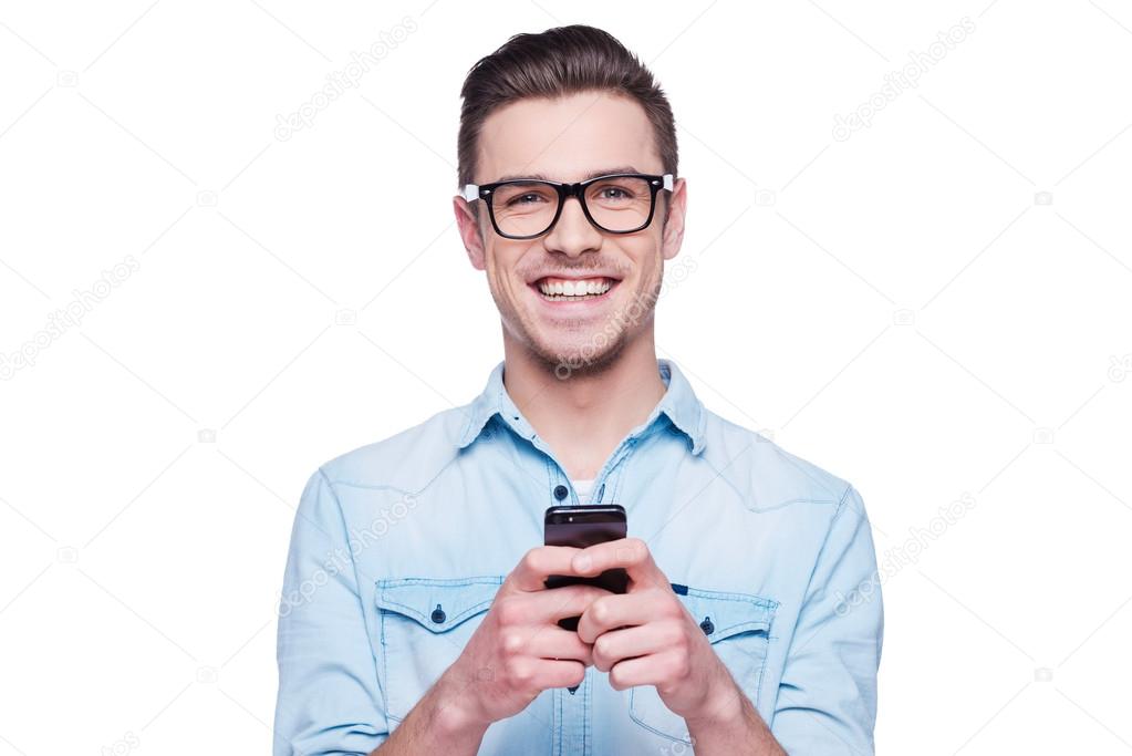 Young man holding mobile phone