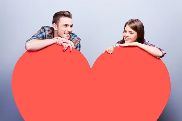 Loving couple  leaning at heart — Stock Photo, Image
