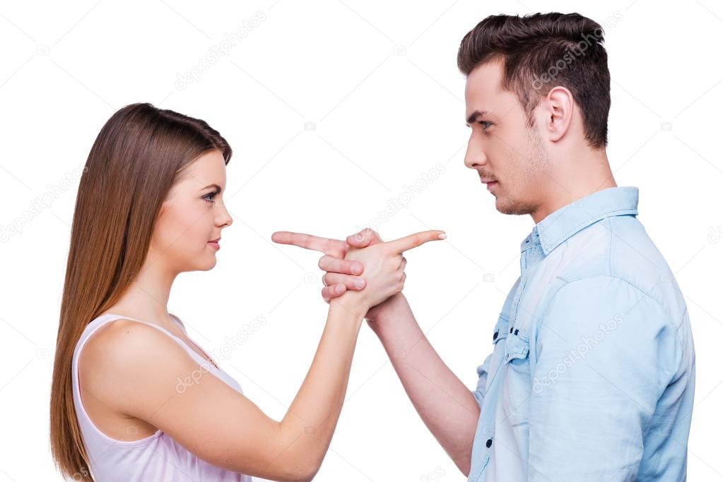 Loving couple pointing each other