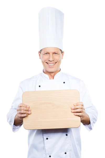 Mature chef holding cutting board — Stock Photo, Image