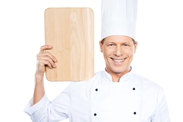 Mature chef carrying cutting board — Stock Photo, Image