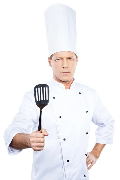 Mature chef  holding spatula — Stock Photo, Image