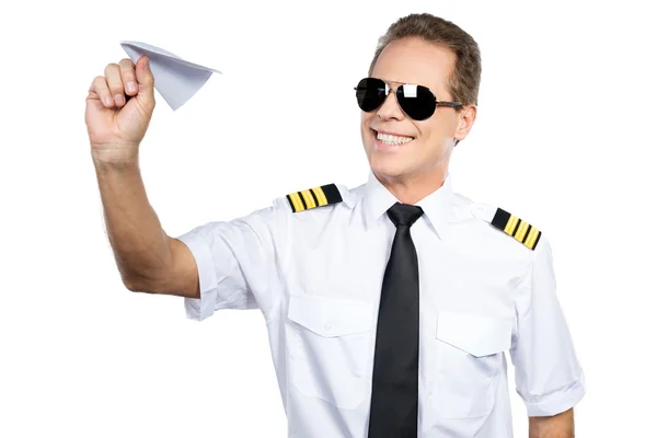 Pilot playing with paper airplane — Stock Photo, Image