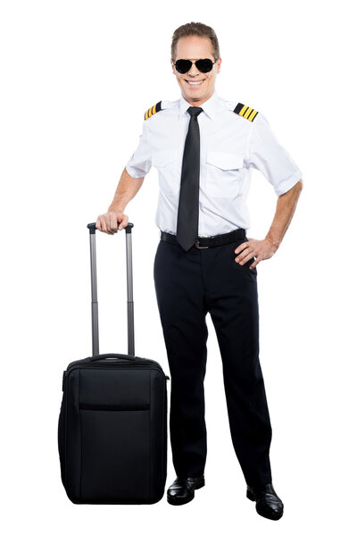 Pilot in uniform with suitcase