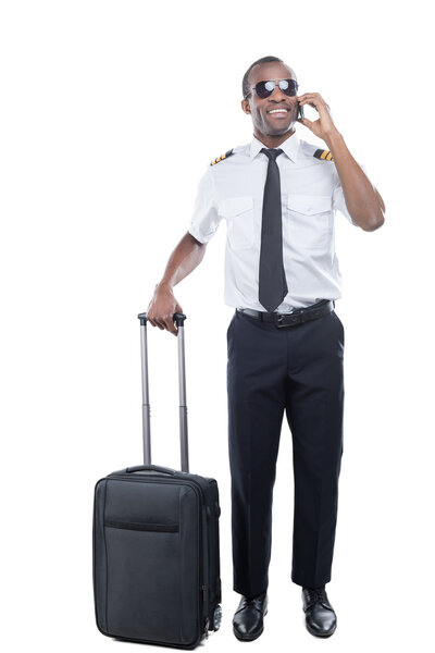 Confident African pilot in uniform