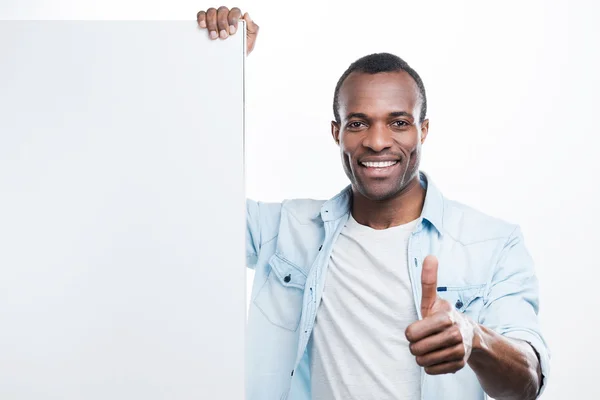 Man gesturing and leaning at copy space — Stock Photo, Image
