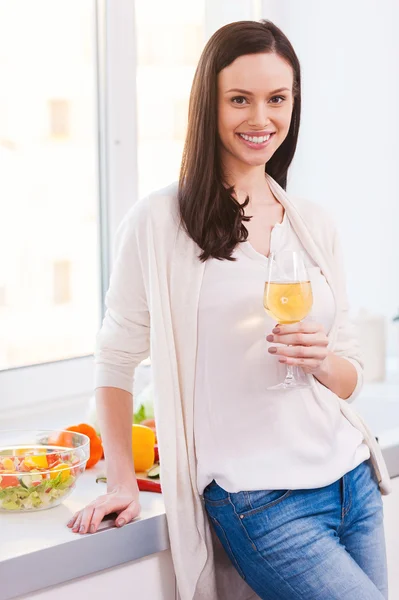 Young woman holding glass with wine — Stock Photo, Image