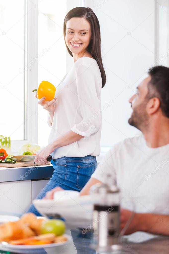 Young couple in kitchen together