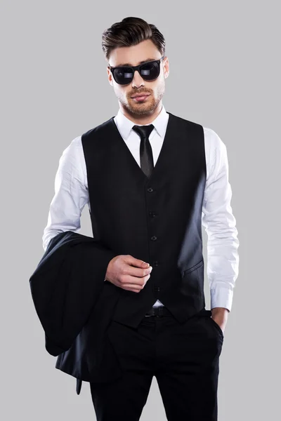 Man in formal wear carrying jacket — Stock Photo, Image