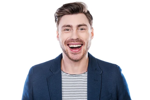 Young man looking at camera and smiling — Stock Photo, Image