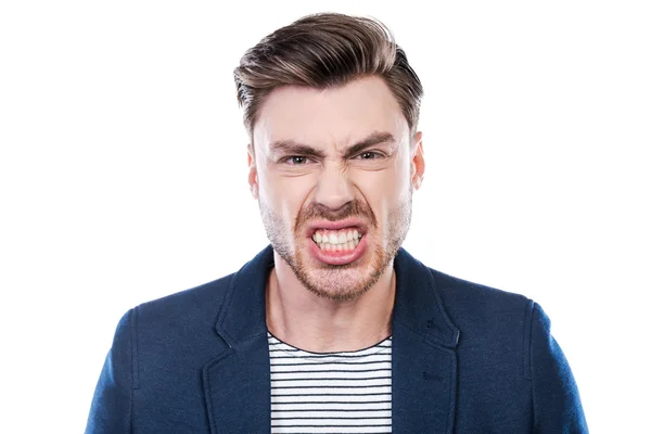 Furious young man grimacing — Stock Photo, Image