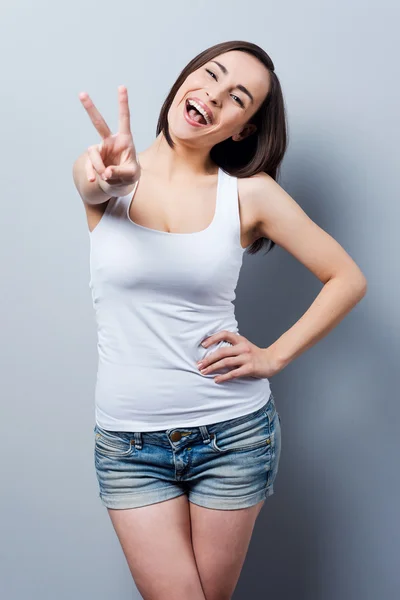 Young woman gesturing at camera — Stock Photo, Image