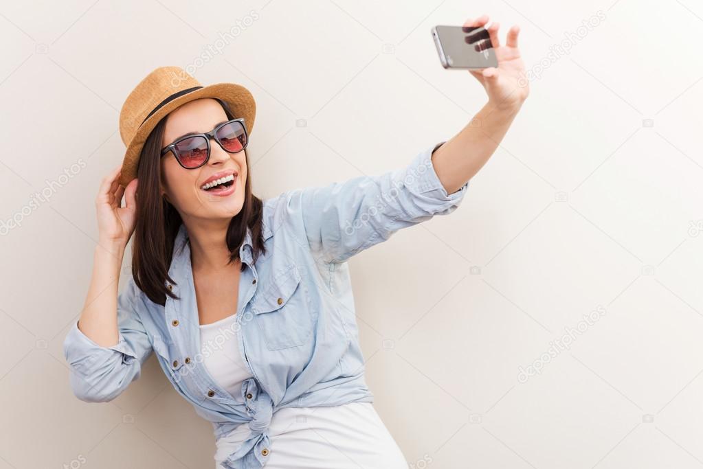Woman in glasses making selfie