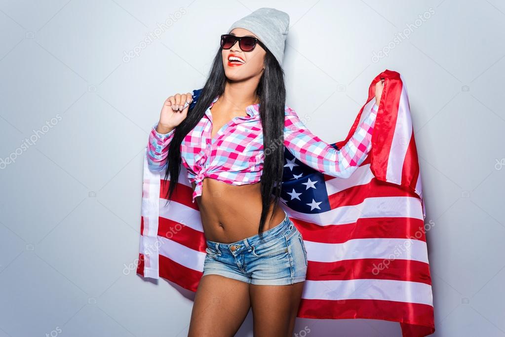 Young woman covered with American flag