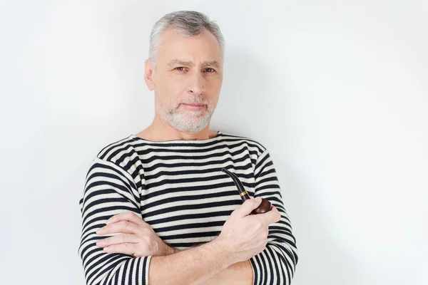 Senior bearded man smoking pipe — Stock Photo, Image