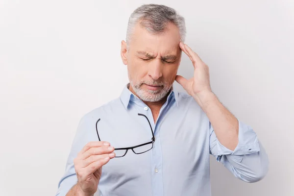 Frustrated senior man touching head — Stock Photo, Image