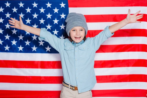 Little boy keeping arms raised — Stock Photo, Image