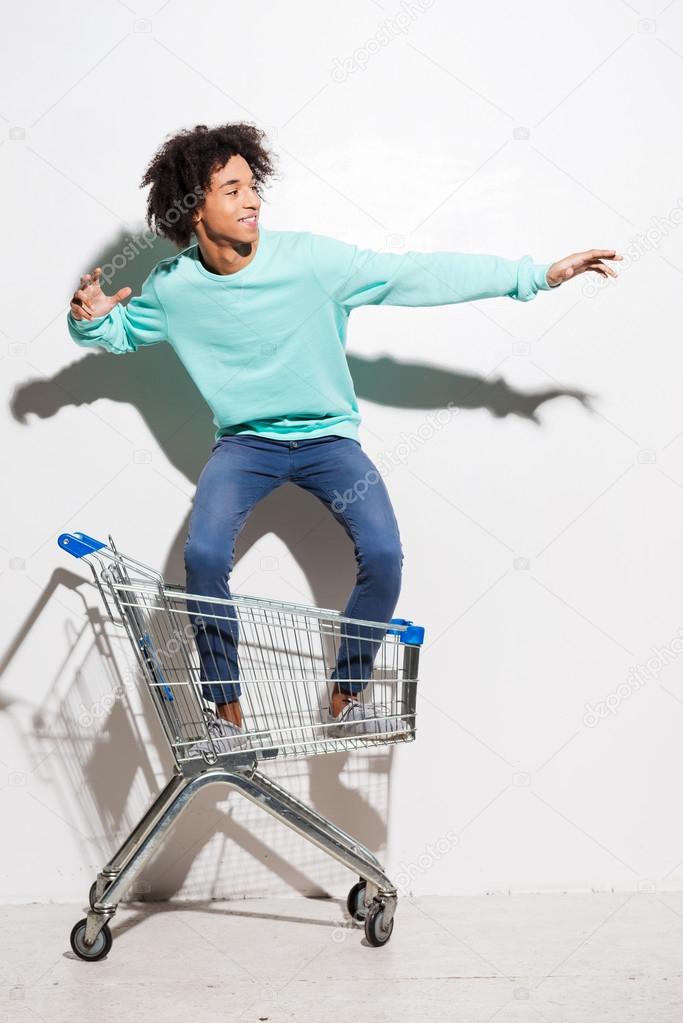 African american boy in shopping cart
