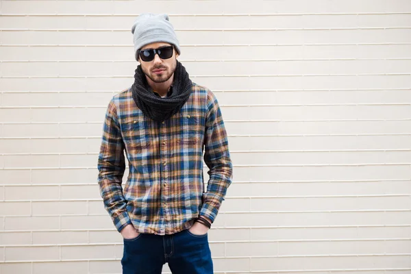 Young man in hat and sunglasses — Stock Photo, Image