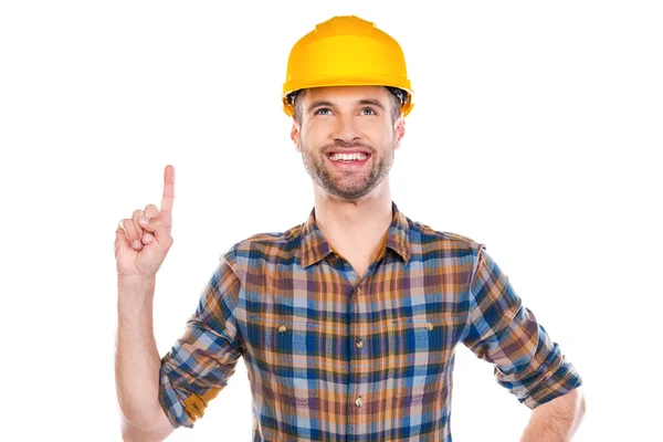 Male carpenter pointing up and smiling — Stock Photo, Image