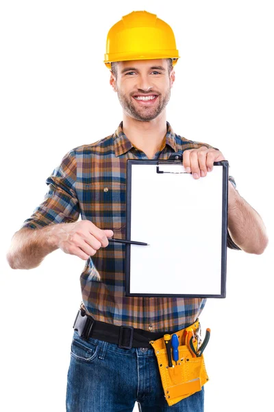 Cheerful male carpenter holding clipboard — Stock Photo, Image