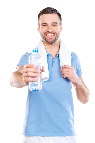 Man stretching out bottle with water Royalty Free Stock Photos