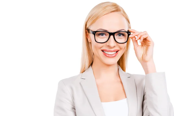 Businesswoman adjusting her glasses — Stock Photo, Image