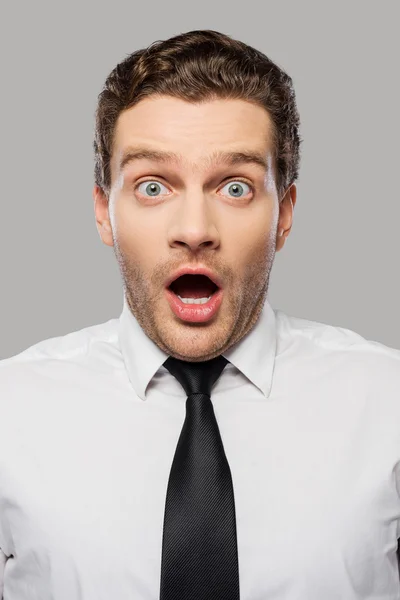 Surprised young man in shirt and tie — Stock Photo, Image