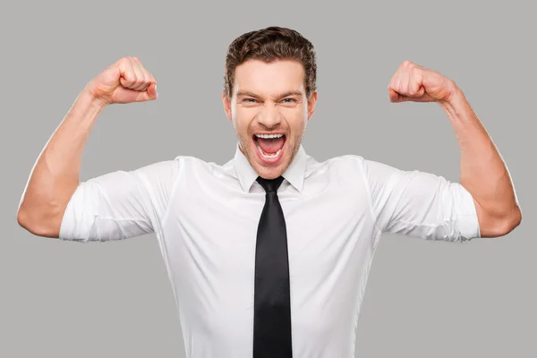 Man in shirt and tie showing his biceps — Stock Photo, Image