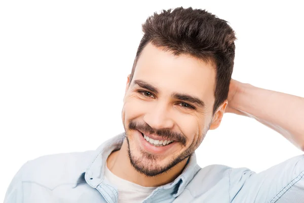 Handsome young man touching his head — Stock Photo, Image