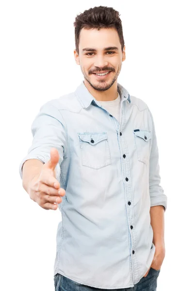 Young man stretching out hand — Stock Photo, Image