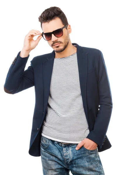 Young man adjusting his sunglasses — Stock Photo, Image