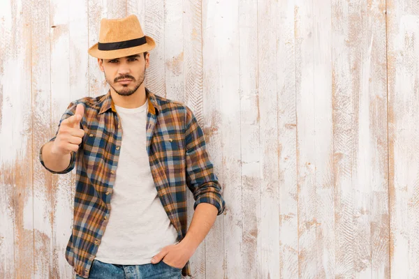 Handsome young man looking and pointing — Stock Photo, Image