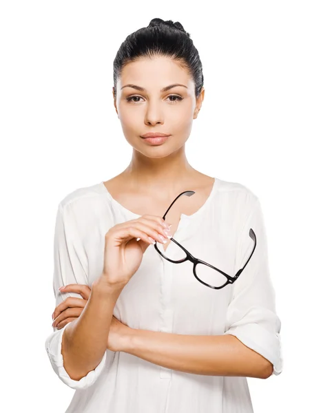 Mujer reflexiva sosteniendo gafas —  Fotos de Stock