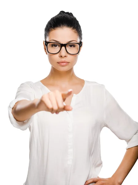 Young woman pointing and at camera Stock Photo