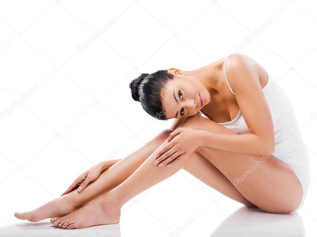 Woman holding hands on legs