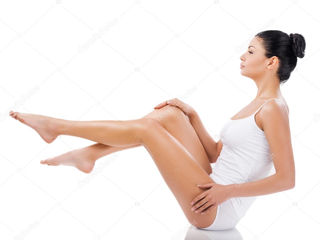 Woman holding her legs in air