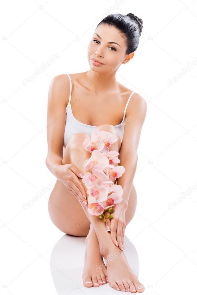 Woman holding orchid flower
