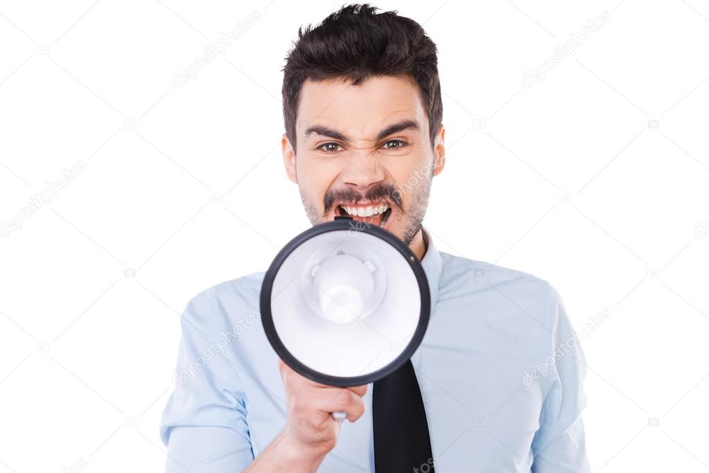 Furious man holding megaphone and shouting