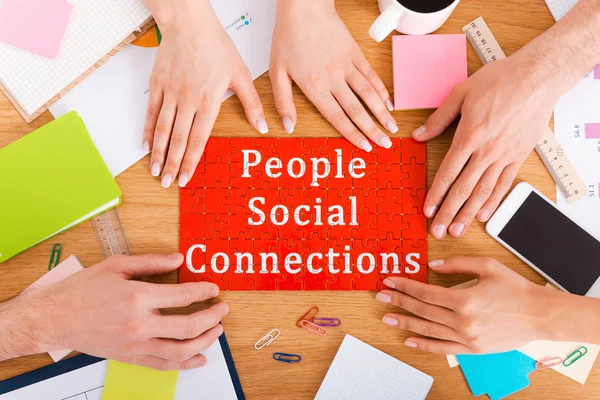 People touching puzzle with social connection — Stock Photo, Image