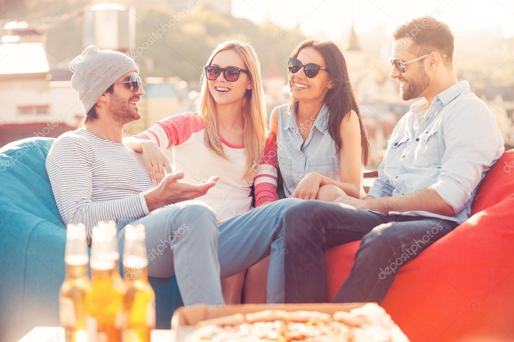 People chatting while sitting at bean bags