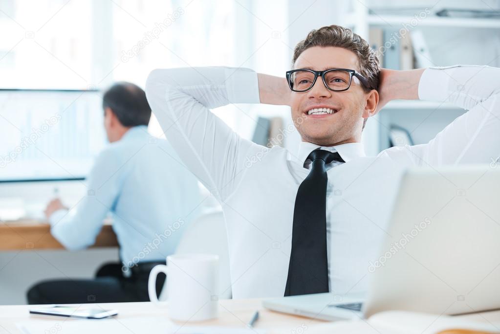 Cheerful businessman in office
