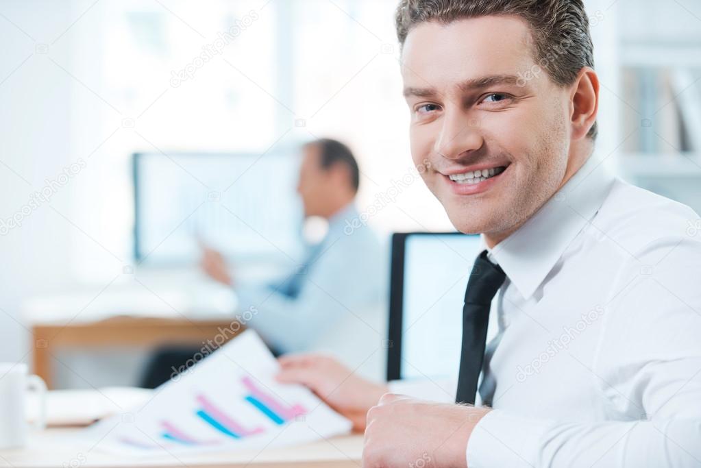 Businessman in formalwear looking over shoulders