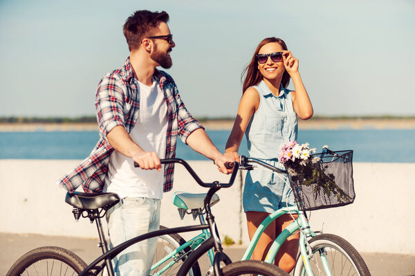 woman holding colorful balloons