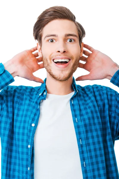 Hombre sosteniendo la cabeza en las manos y sonriendo —  Fotos de Stock