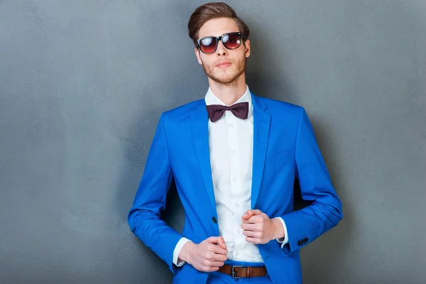 Man in eyewear adjusting his jacket — Stock Photo, Image