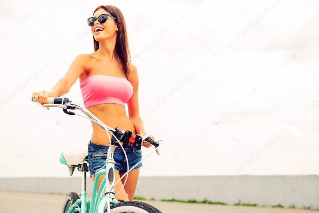 woman standing near her bicycle